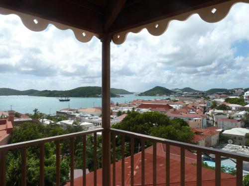 a view of a city from a balcony at Galleon House Hotel in Charlotte Amalie