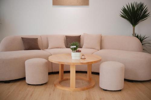 a living room with a couch and a table at Glory 2 Hue Homestay in Hue