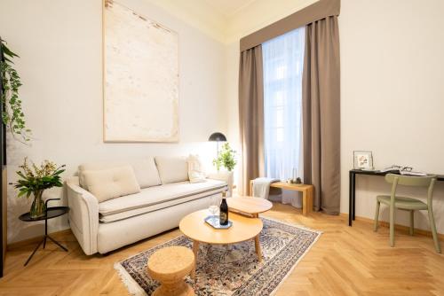 a living room with a couch and a table at Zámek Načeradec in Načeradec