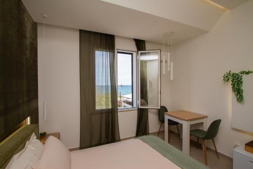 Ένα ή περισσότερα κρεβάτια σε δωμάτιο στο Suites Domus Fysi
