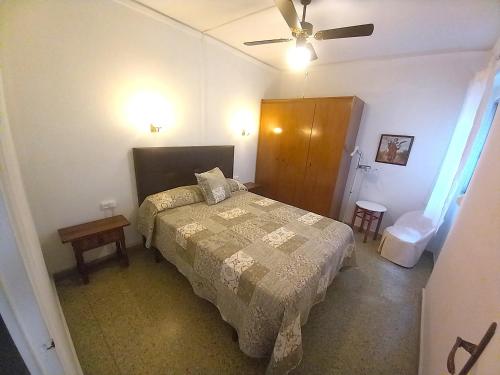 a bedroom with a bed and a ceiling fan at Victoria, 8-22 in Cullera