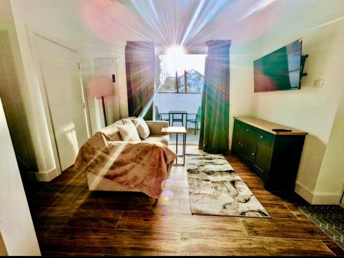 a living room with a couch and a table at Hideaway Suite in Ambleside