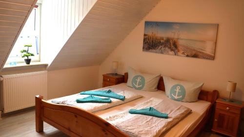 Postel nebo postele na pokoji v ubytování Ferienhaus DünenRose