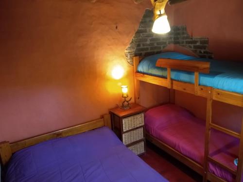 Ένα ή περισσότερα κρεβάτια σε δωμάτιο στο Hostel Eco Cultural GIRAMUNDO