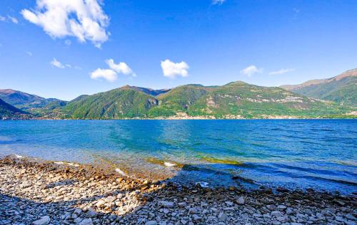 a view of a lake with mountains in the background at Appartamenti Portobello in Lezzeno