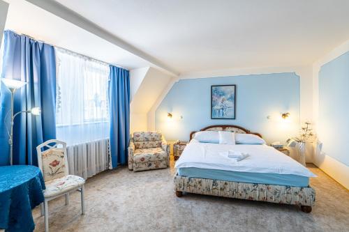 Postel nebo postele na pokoji v ubytování Hotel Trumf