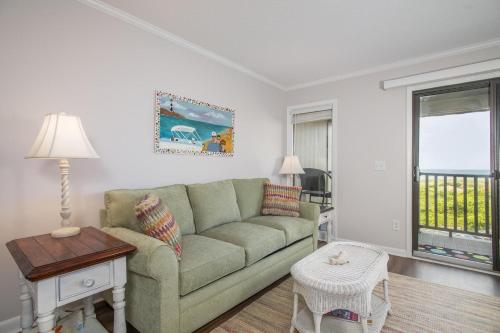 a living room with a couch and a table at Southwinds G16 condo in Atlantic Beach