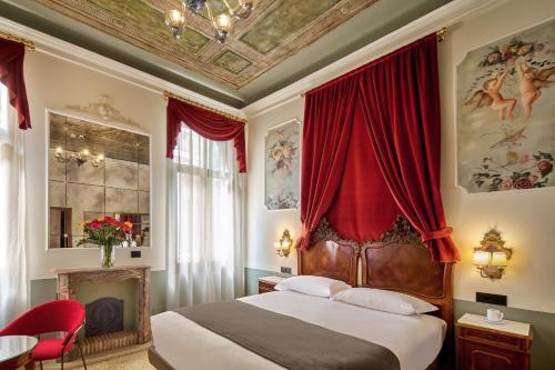 Postel nebo postele na pokoji v ubytování UNAHOTELS Ala Venezia-Adults 16