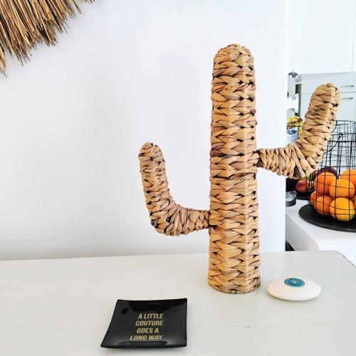 a vase shaped like a snake sitting on a table with a plate at Island Magic - Seaview Villa with Jacuzzi Pool in Ambelas