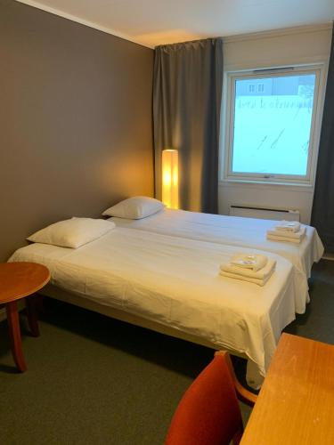 Postel nebo postele na pokoji v ubytování Narvik Budget Rooms