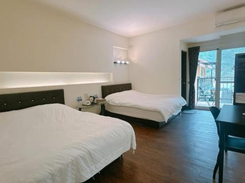 Postel nebo postele na pokoji v ubytování Lan Dragonfly B&B