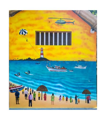 a painting of people on a beach with a lighthouse at Avatar Sea Beach Homestay in Malpe