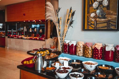 a buffet with bowls of food on a table at Servi House - Trabzon in Trabzon