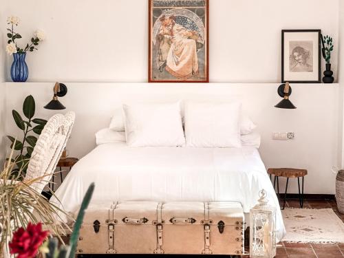 Postel nebo postele na pokoji v ubytování La Casería Azul de Cuadros