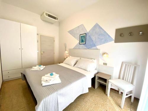 Postel nebo postele na pokoji v ubytování Alevon Hotel