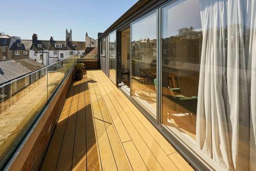 a balcony with a view of a house at Host & Stay - Palm Penthouse in Brighton & Hove