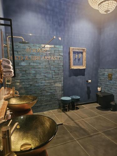 a bathroom with a sink at Roomz B&B in Kloosterzande