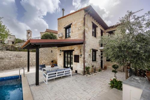 a house with a pool in front of it at Stroumpi Private Pool Villa in Stroumbi