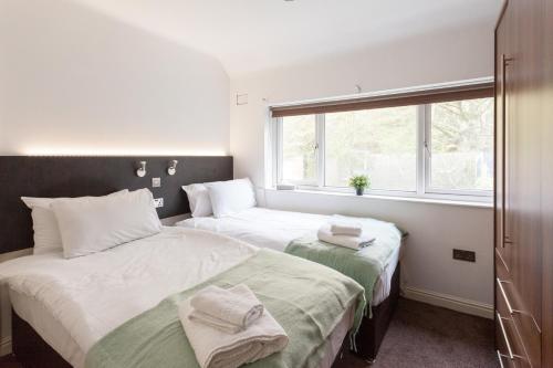 Ένα ή περισσότερα κρεβάτια σε δωμάτιο στο Cosy 3 bedroom house in quiet residential area