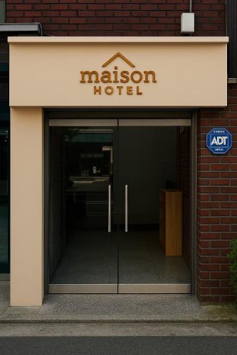 an entrance to a modern hotel with a glass door at Maison Dongdaemun myeongdong hotel in Seoul