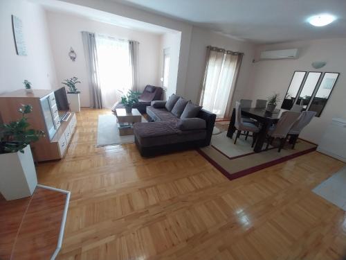 a living room with a couch and a table at Sorin Apartments Gevgelija in Gevgelija