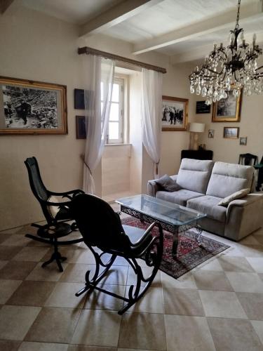 a living room with a couch and a table at Birgu Heritage Treasure 2 in Birgu
