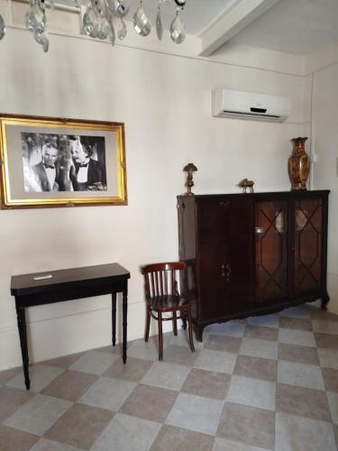 a living room with a table and a cabinet at Birgu Heritage Treasure 2 in Birgu