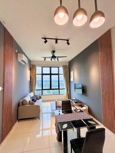 a living room with a couch and a table at D'Summit Suite by Luxecocoo CK Kempas Setia Tropika in Kempas