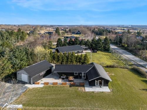an aerial view of a house with a yard at Modern Holiday Home With 3 Bedrooms, Completely Renovated In 2025 And Located Close To Rinkøbing Fjord in Skjern