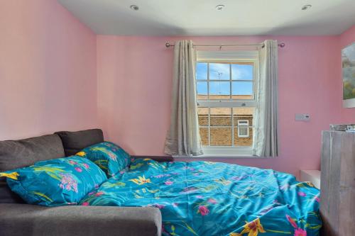 a living room with a couch and a window at Finest Retreats - The Nest in London