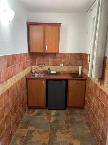 Η κουζίνα ή μικρή κουζίνα στο Sereno Village