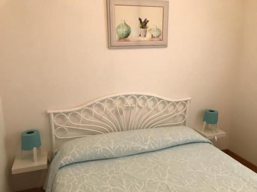 En eller flere senge i et værelse på Villa Marina primo piano