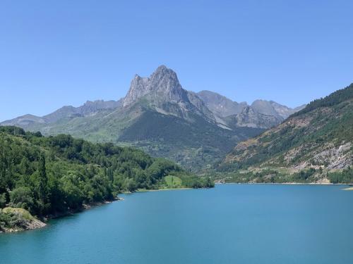 a view of a lake with mountains in the background at Chalet Anayet Lodge Luxury 5 Stars in Formigal in Formigal