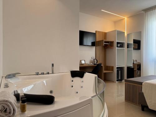 a large white bath tub in a room at B&B Affittacamere Vecchia Alimini in Otranto