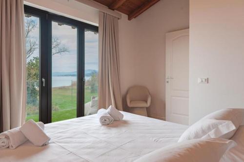 Postel nebo postele na pokoji v ubytování Villa Trasimeno La Torricella