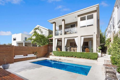 a house with a swimming pool in front of it at Large Family Home with Pool & Spa in Brisbane