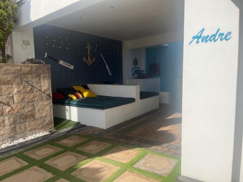 a bed in a room with a wall with baseball equipment at Withuis Hartenbos - No Load Shedding in Hartenbos