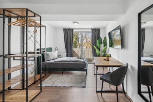 a bedroom with a bunk bed and a desk at Larooms - Nula#3 in Merseburg