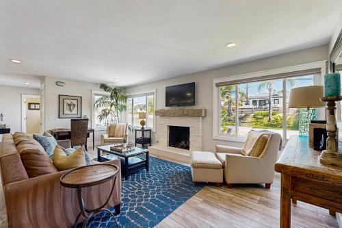 a living room with a couch and a fireplace at Ola Vista in San Clemente