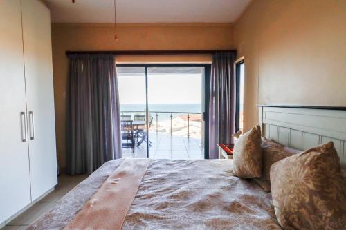 Postel nebo postele na pokoji v ubytování Whale Rock 23