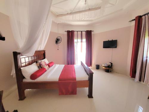Ein Bett oder Betten in einem Zimmer der Unterkunft Philo Leisure Gardens