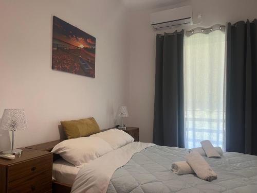 Кровать или кровати в номере Olympia House Dionisos and Dimitra III