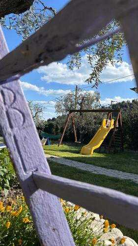 a park with a playground with a slide at B&B Tor Di Lupo in Mattinata