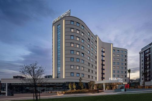 a large white building with a sign on it at Four Points by Sheraton Istanbul Pendik in Istanbul