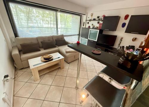 a living room with a couch and a table at TomNok in Salou