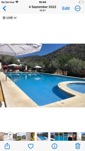 a collage of two pictures of a swimming pool at Large 1 bed apartment in the beautiful countryside in Rute