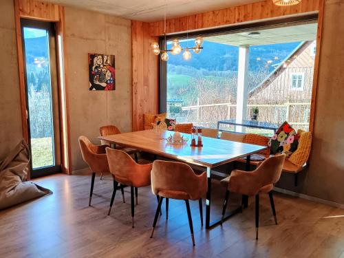 a dining room with a wooden table and chairs at Výhledovka chalet in Rokytnice nad Jizerou