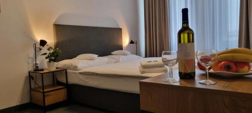 Un ou plusieurs lits dans un hébergement de l'établissement Hotel Legie