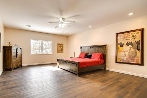 a bedroom with a bed and a ceiling fan at Hot Tub and Sauna Hoffman Estates Villa in Elgin! in Elgin
