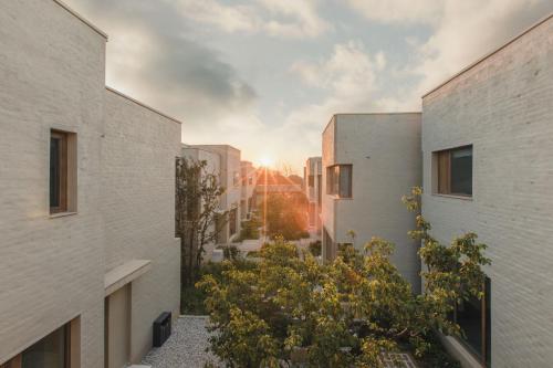 a view of a courtyard between two buildings at The Long Circle House in Yanqing